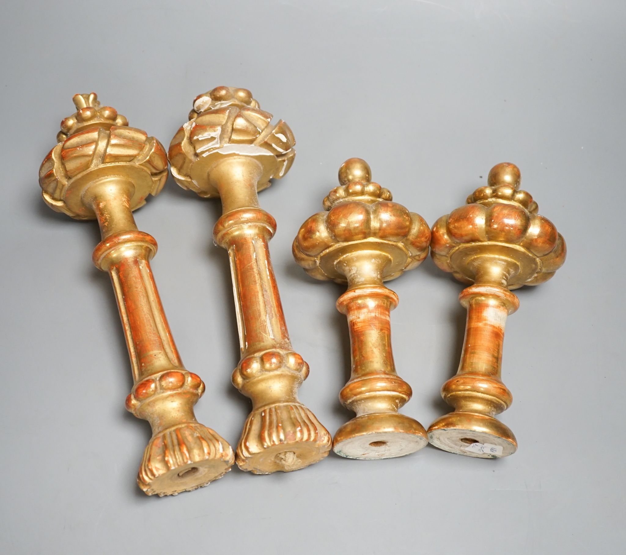Two sets of four giltwood curtain tie/hold backs, Longest 31 cms.